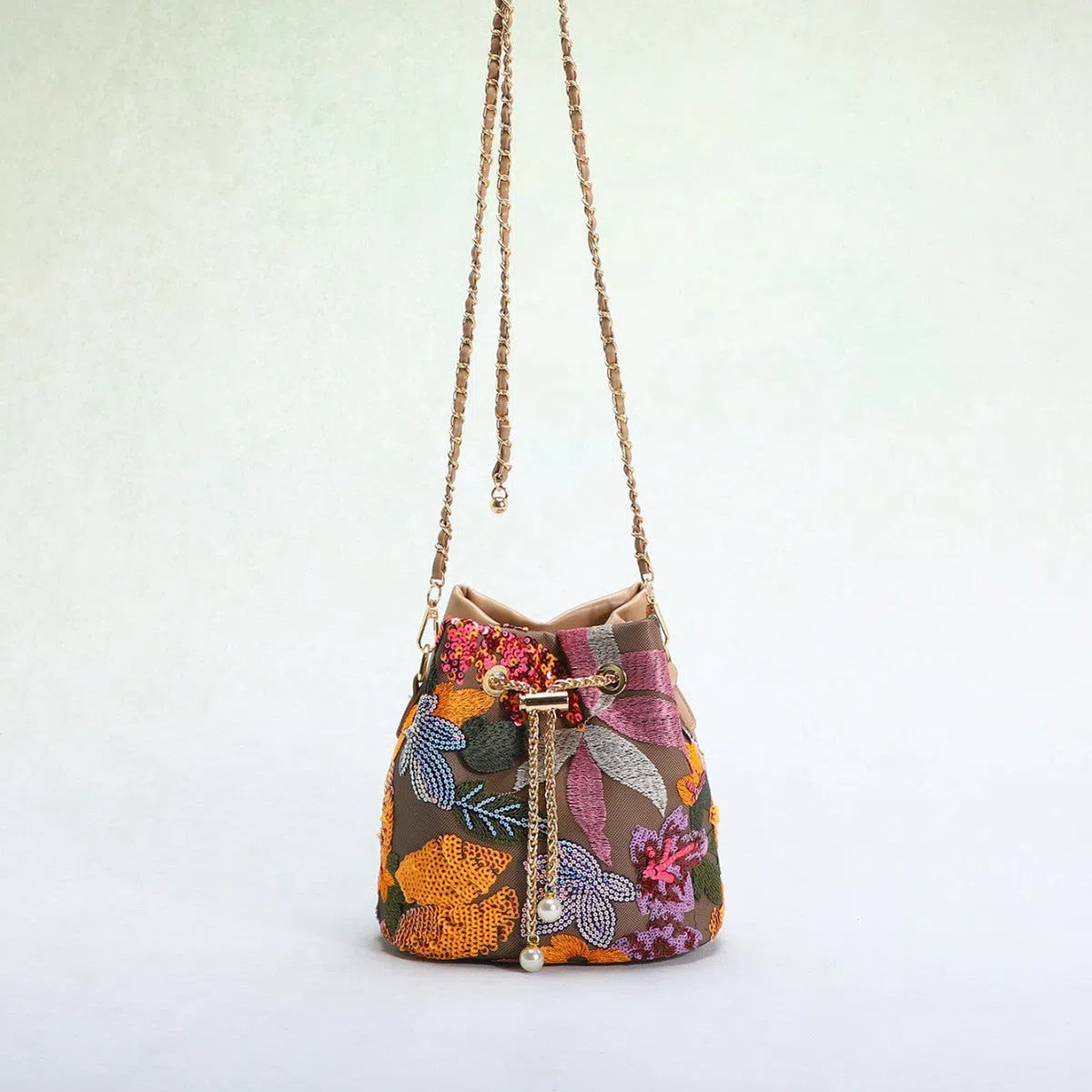 Bucket bag with mesh patchwork contrasting colours drawstring and chain strap in beige PVC material