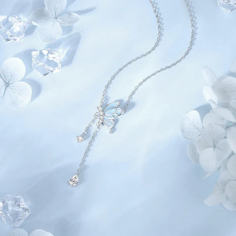 925 sterling silver butterfly tassel noctilucent necklace with O-ring chain on model, luminous pendant visible in low light