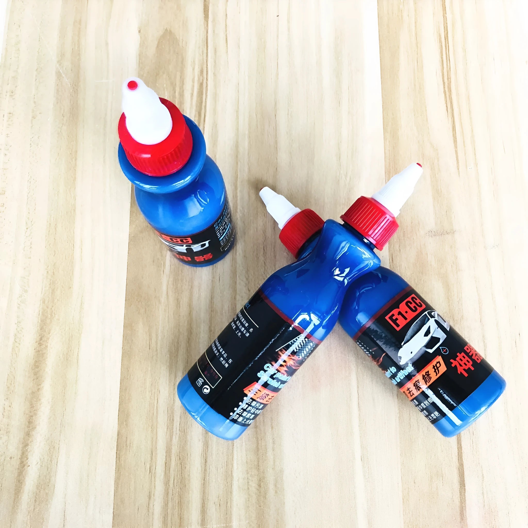 Small blue car wiping tool and scratch repair agent for automotive paint touch-ups