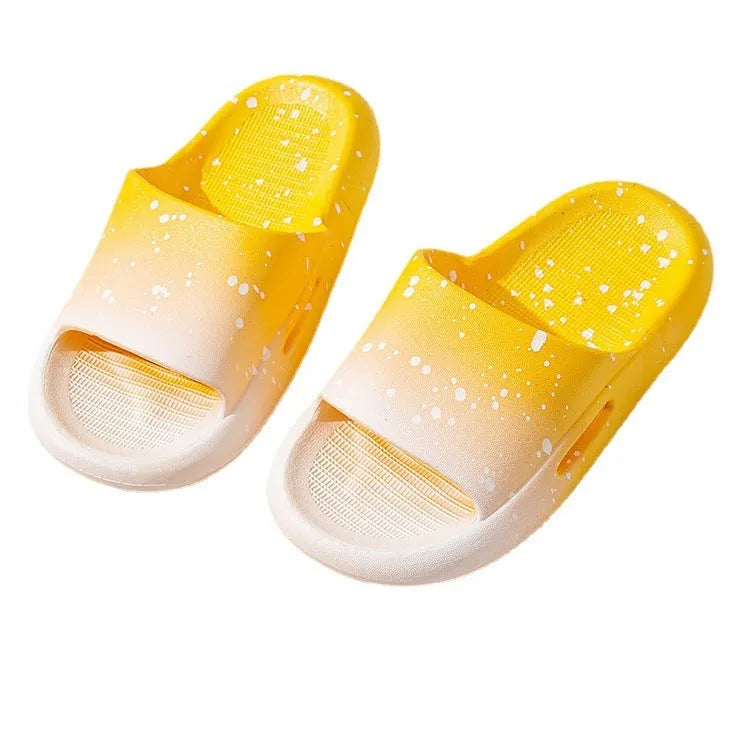 Blue gradient PVC slippers for children on a white background showing the non-slip sole pattern.