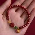 Happy Eyebrow Bracelet with fu charm in emperor sandstone colour, available in 6mm and 8mm sizes.
