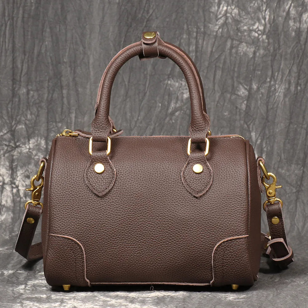 Brown yellow first layer cowhide Boston bag with cylindrical shape and single shoulder strap