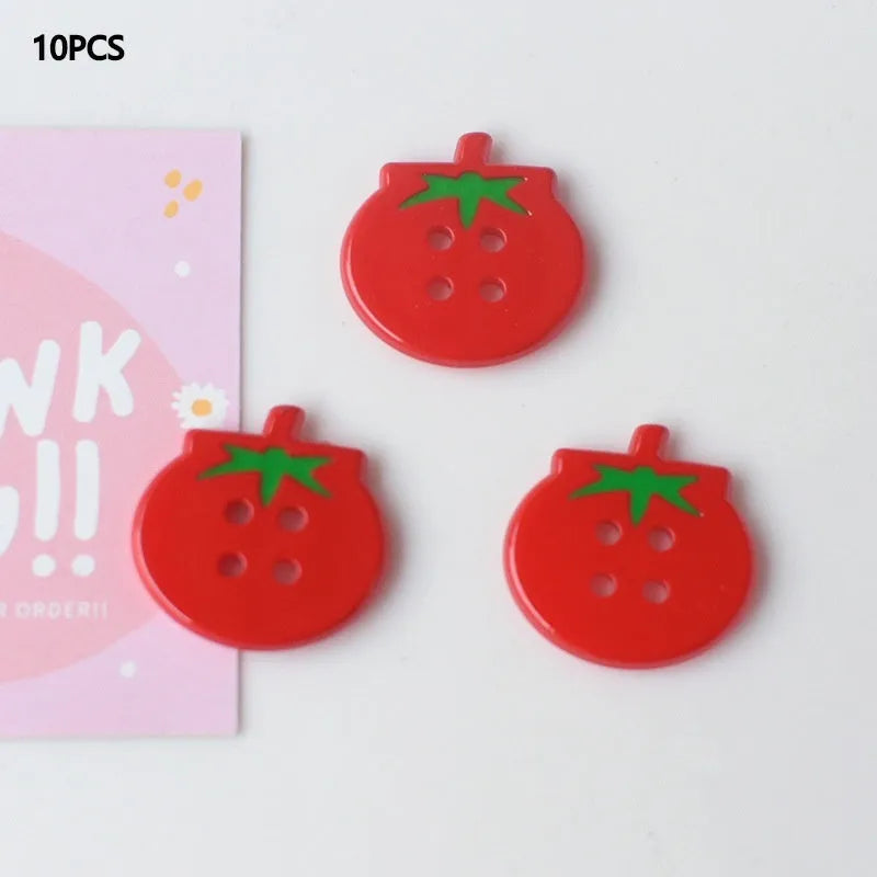 Medium tomato-themed plastic buttons in red colour variations including cherry tomato printing and solid red