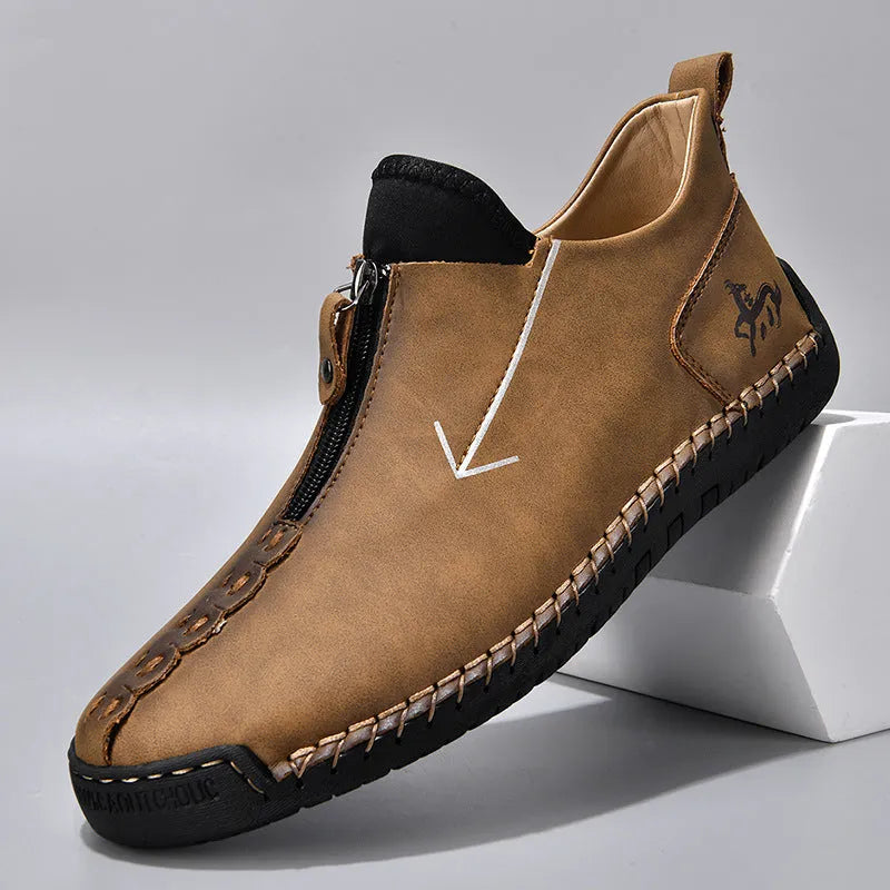 Men's black casual leather boots with a front side zipper and a hand-stitched rubber sole.
