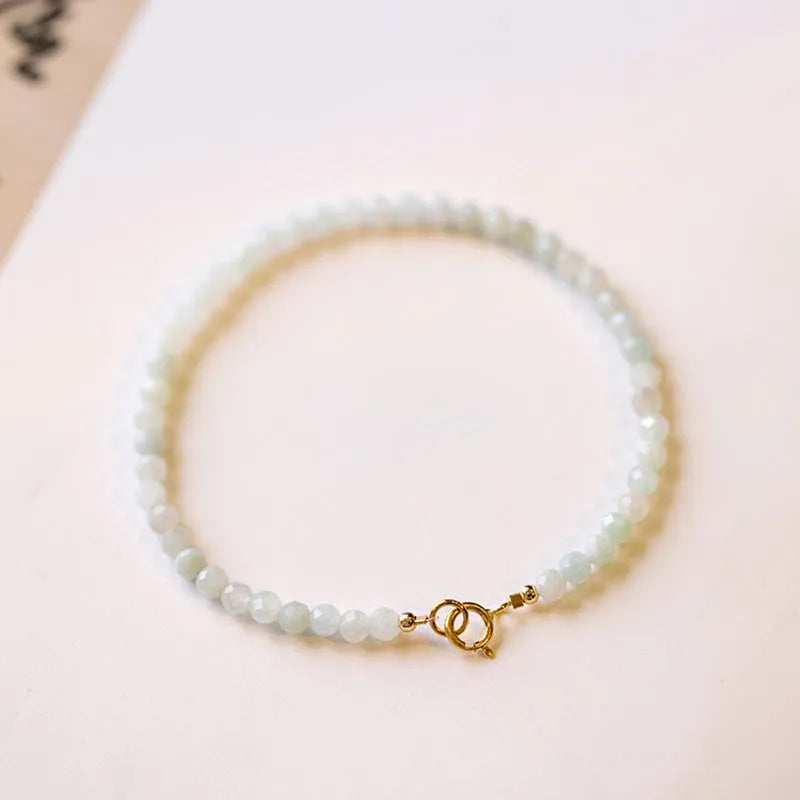 Women's Korean style retro jade ball bracelet on a wrist, showing the bead detail and chain clasp.