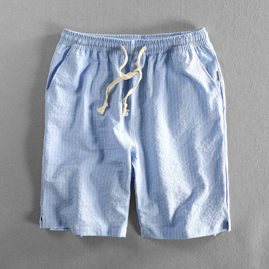 Men's striped casual shorts in cotton, shown in a loose straight-leg fit on a mid-waist.