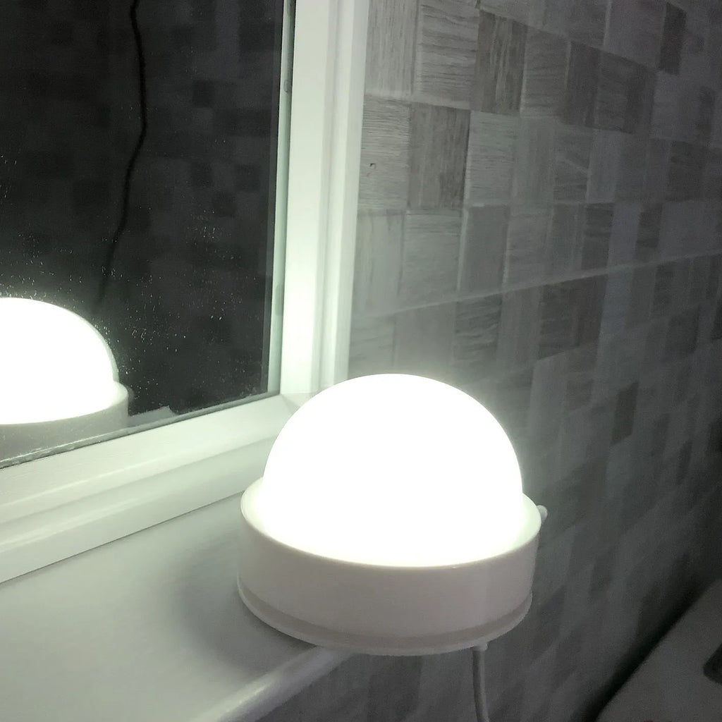 Colourful gradient 3D shooting night light with remote control on black surface