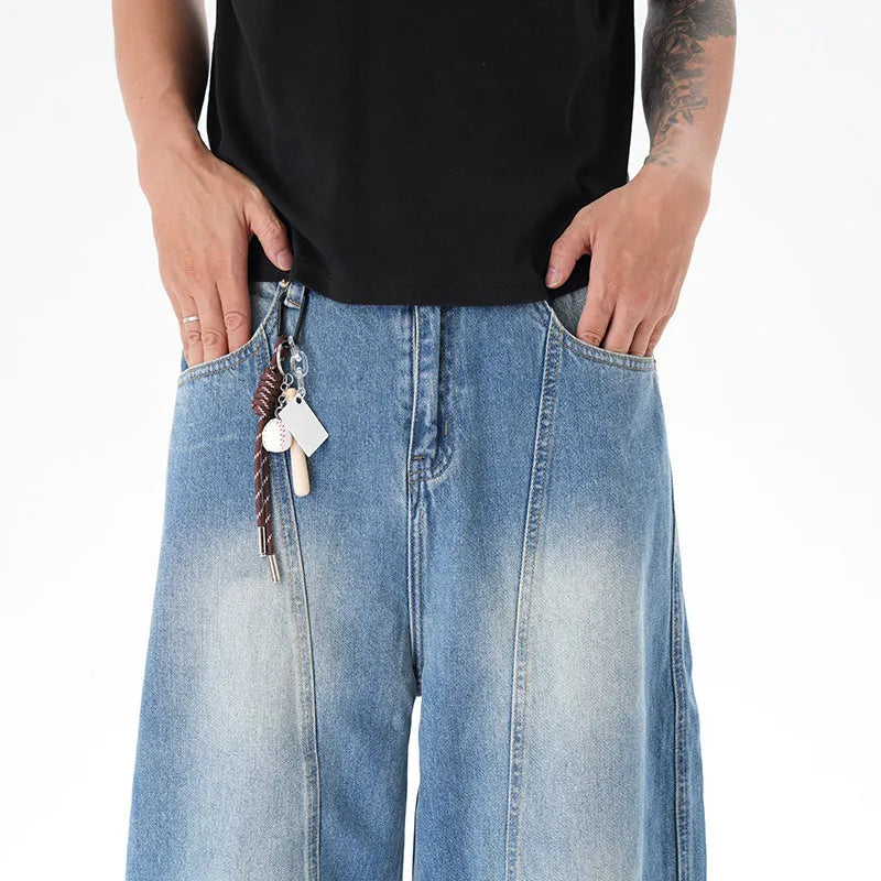 Cut washed vintage washed wide leg machete jeans in light blue denim fabric with zip fly