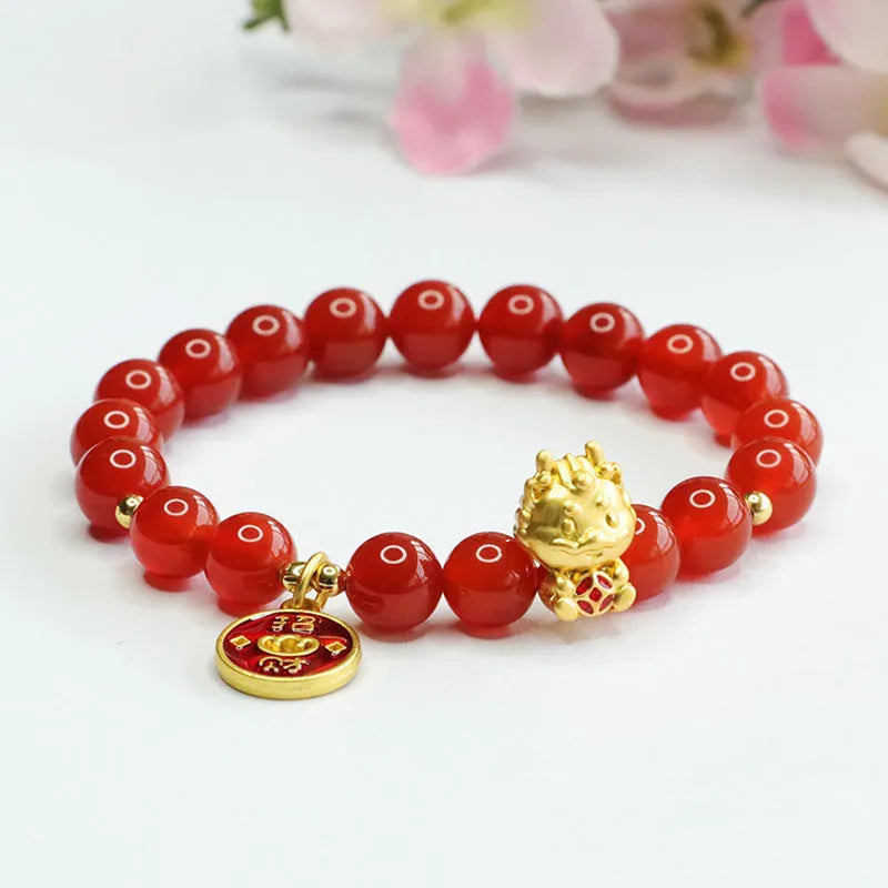 Close-up of a red agate bead dragon zodiac bracelet on a wrist, showing 8mm beads.