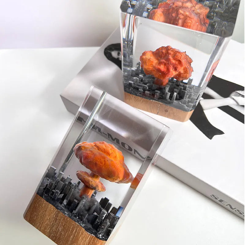 Small resin night lamp shaped like an atomic bomb mushroom cloud in modern simplicity style.
