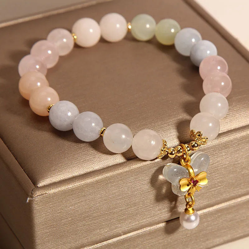 Women's crystal bracelet with butterfly pendant featuring natural morganite stones in candy colours