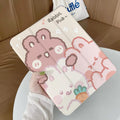 Flat tri-fold silicone iPad case with rabbit cartoon design on a table.