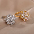 Rotatable flower ring with rhinestones on a woman's finger, available in gold or platinum finish