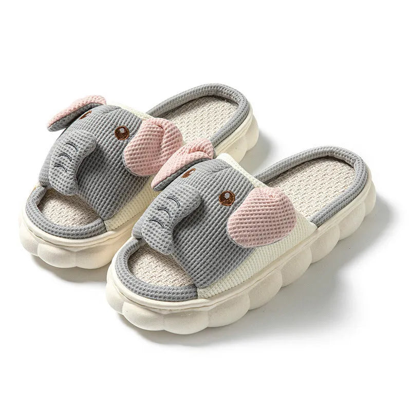 Elephant grey open-toe linen slippers for couples on a plain background, showing animal pattern detail and sewn sole.