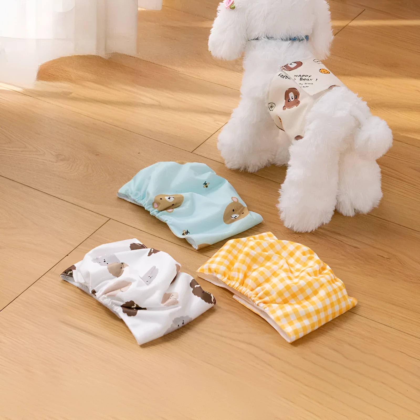 Reusable male dog diaper belly band with cartoon bone paw print design and fastener tape.