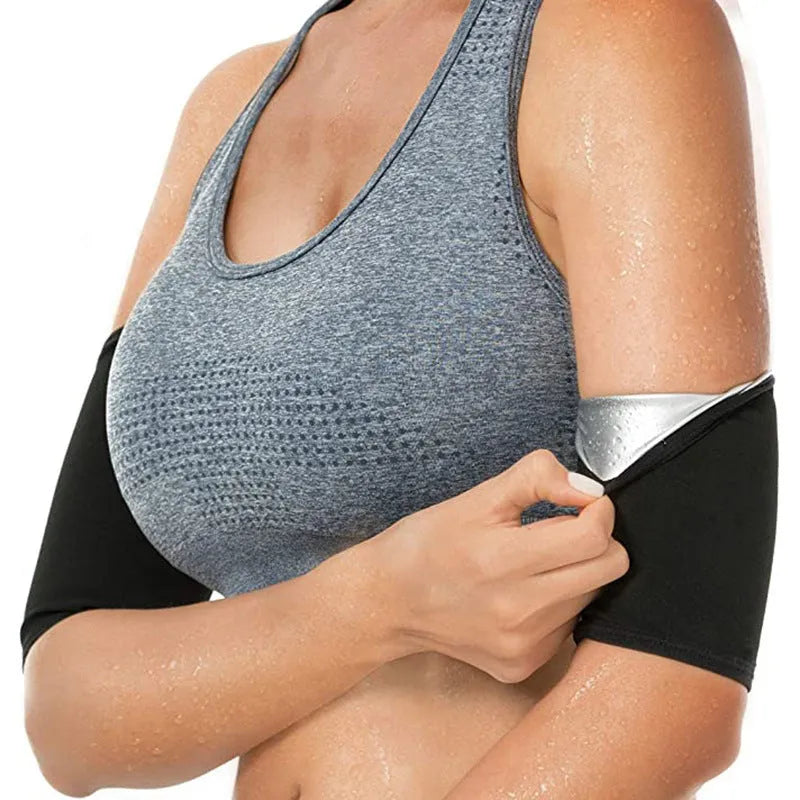 Adjustable arm sweatband in blue on a gym background, showing the binding strap.