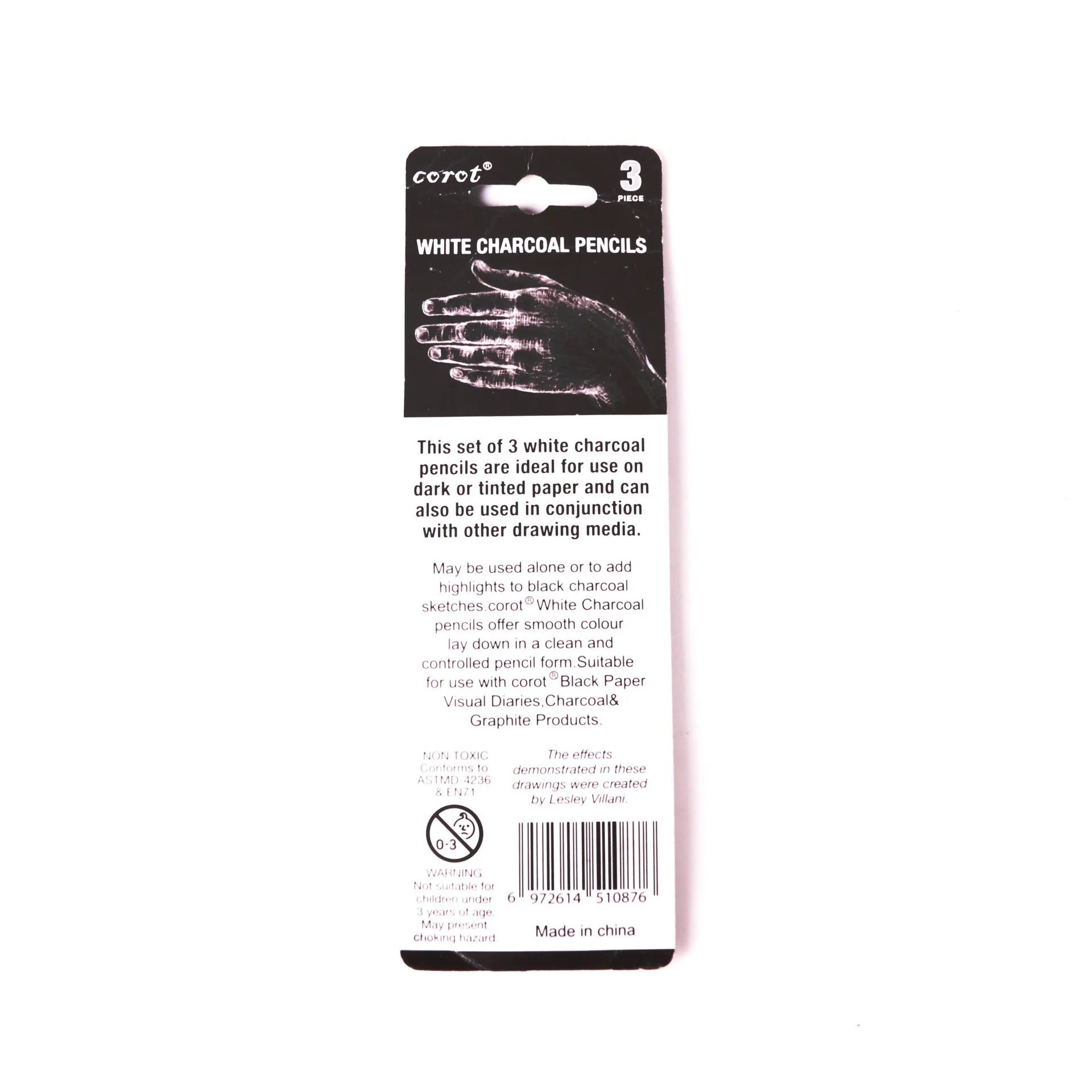 Set of three white charcoal pencils in wooden barrels for sketching on dark paper
