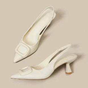 Pointed toe classy high heels with French square buckle in black, cream white, and silver. Microfiber and rubber construction. Sizes 35 to 39.