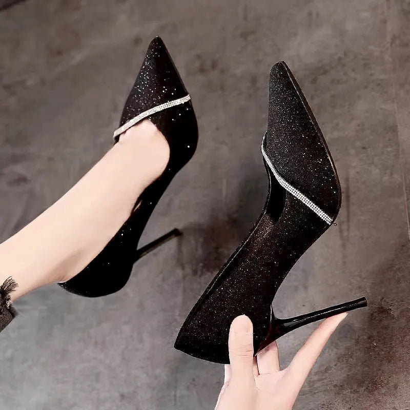 Women's gold stiletto court shoes with pointed toe and 9cm heel on white background