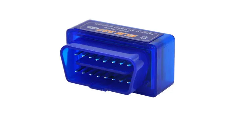 Small black ELM327 OBD2 Bluetooth diagnostic scanner next to a vehicle's OBD2 port.