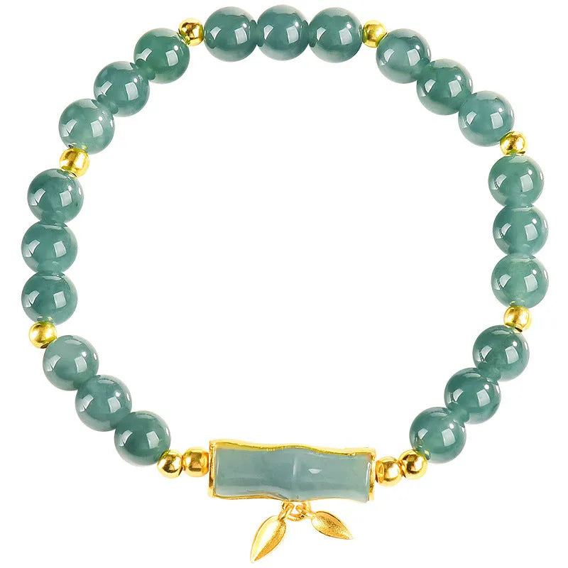 Women's silver bracelet with natural jade and blue beads in a simple high-rise design.