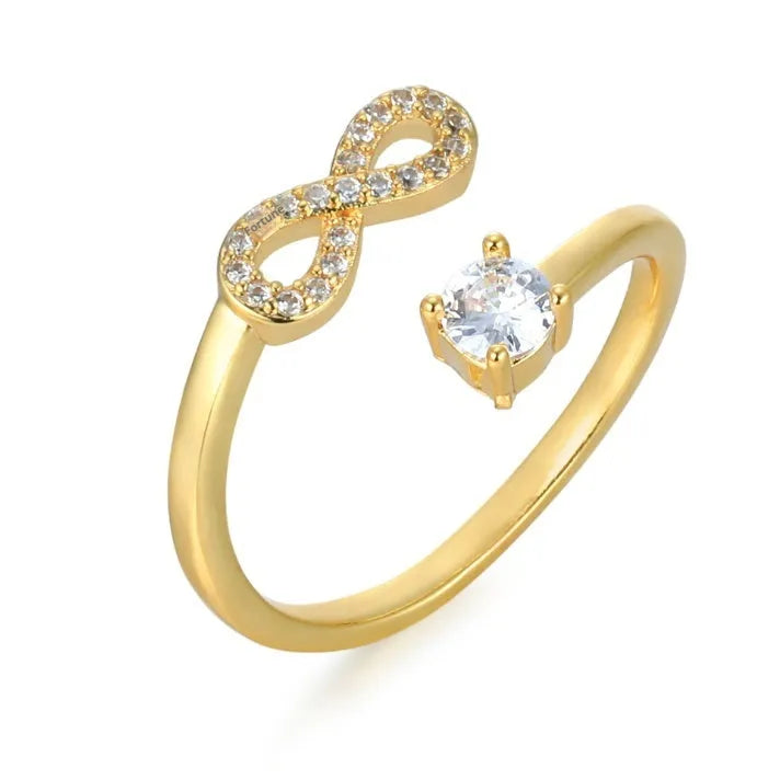Geometric open ring with a zircon stone, personalised with a letter on a model finger.