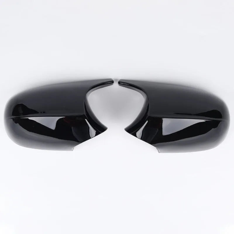 Pair of black ABS plastic rearview mirror shells for BMW 3 Series E90 car.