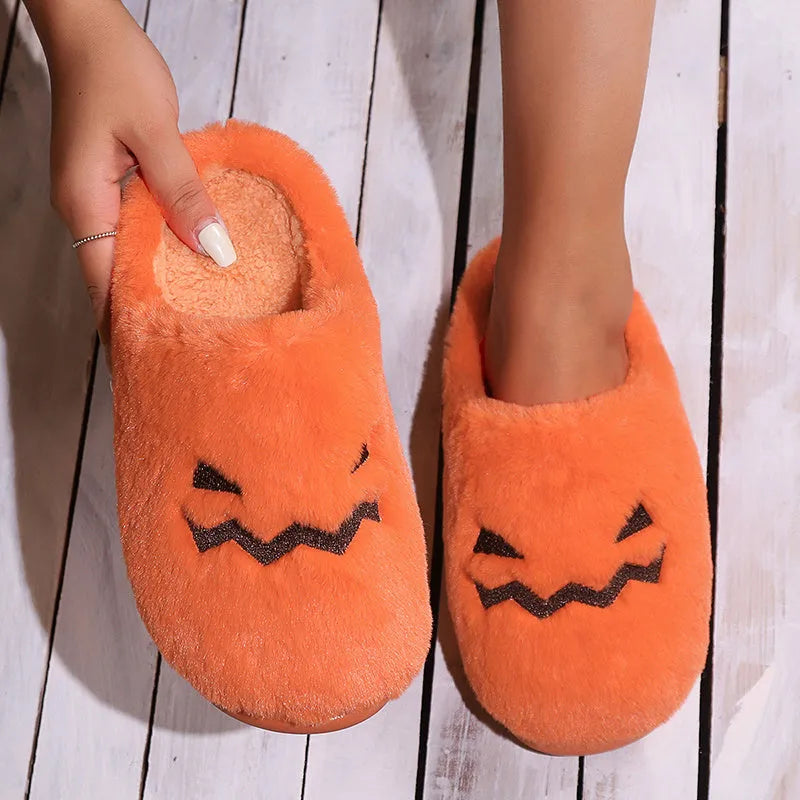 Orange pumpkin-shaped plush slippers with coral velvet upper on a non-slip PVC sole