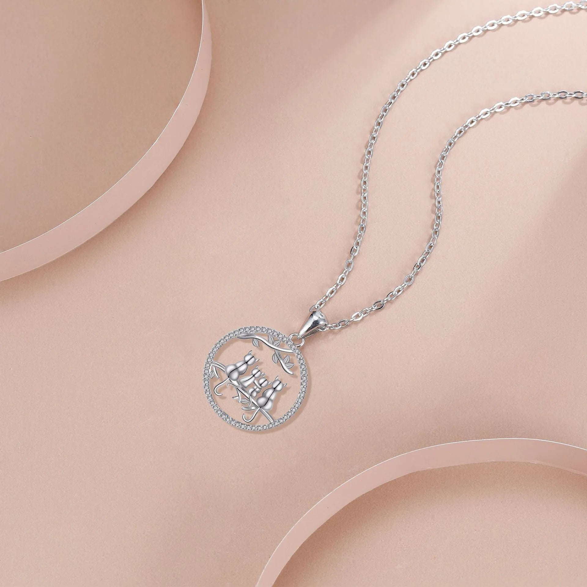 Women's copper necklace with four kitten pendants on cross chain design