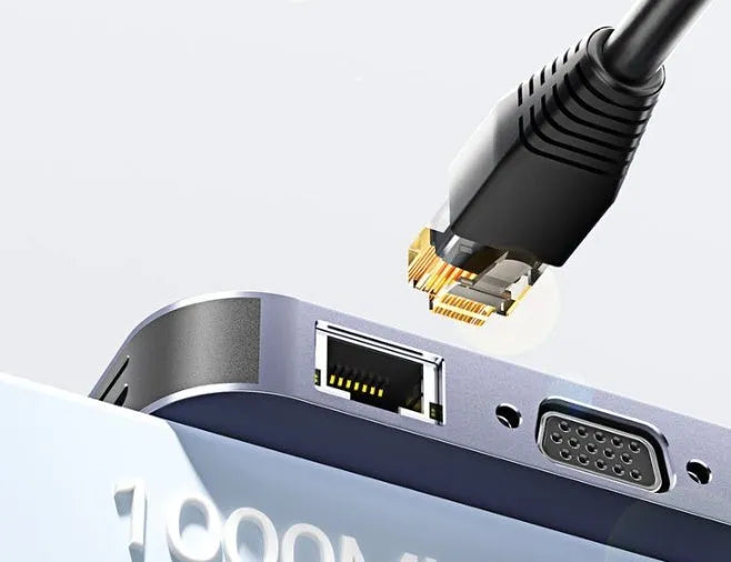 11-in-1 USB-C expansion hub showing multiple ports including Ethernet, HDMI, VGA, USB, and a card reader.