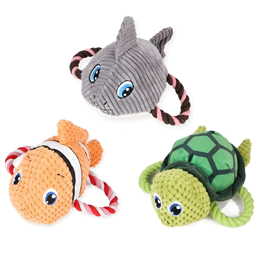 Grey turtle-shaped stuffed dog toy with a visible rope knot centre for chewing.
