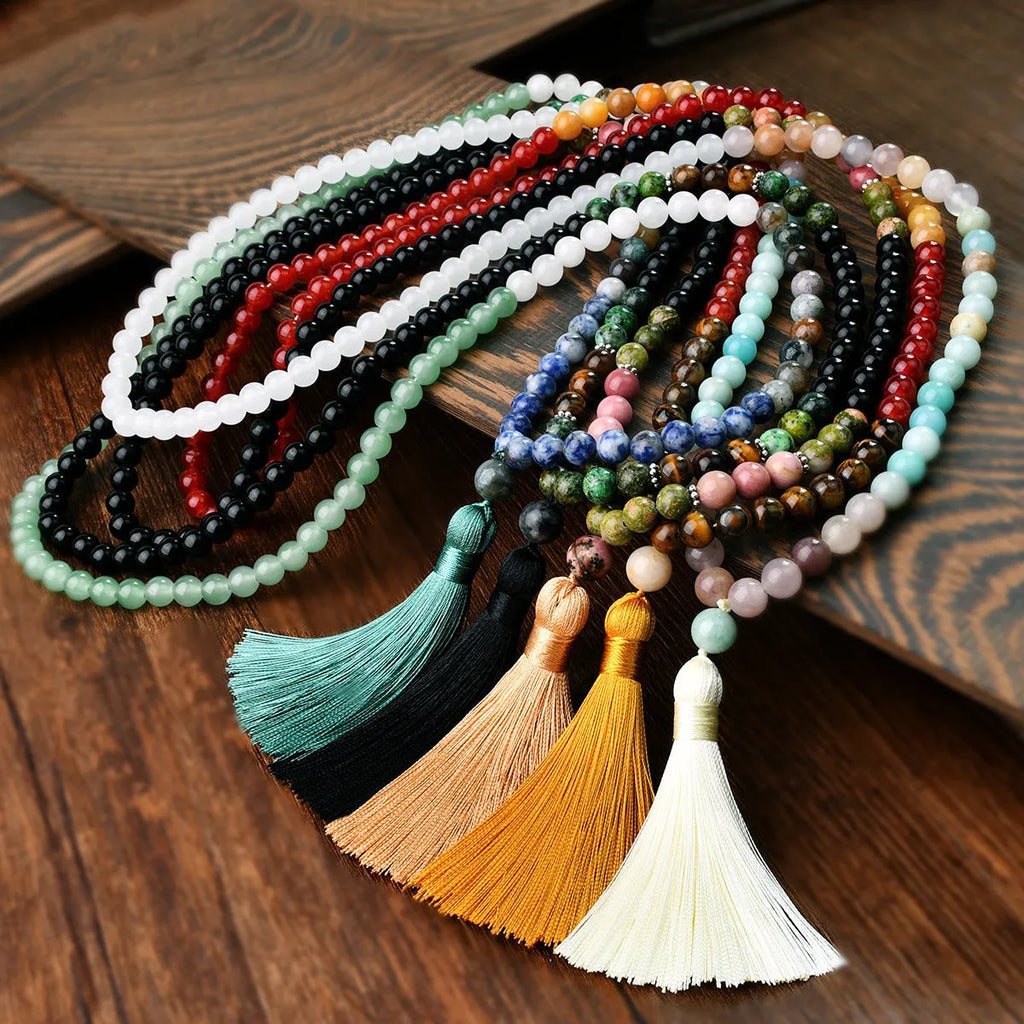 Long 108-bead natural stone necklace with a geometric tassel pendant in bohemian style.