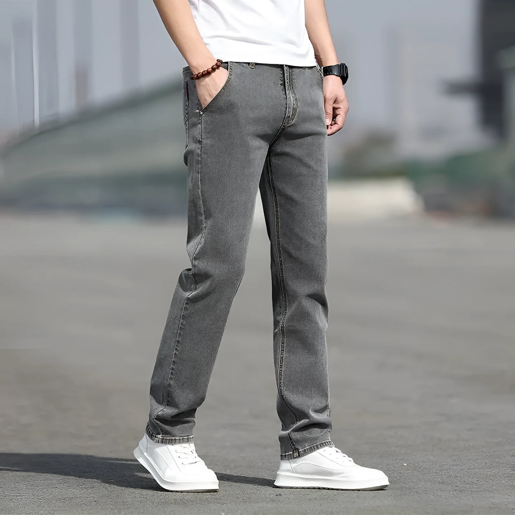 Men's straight leg jeans in smoky grey high elasticity fabric with zip fly closure