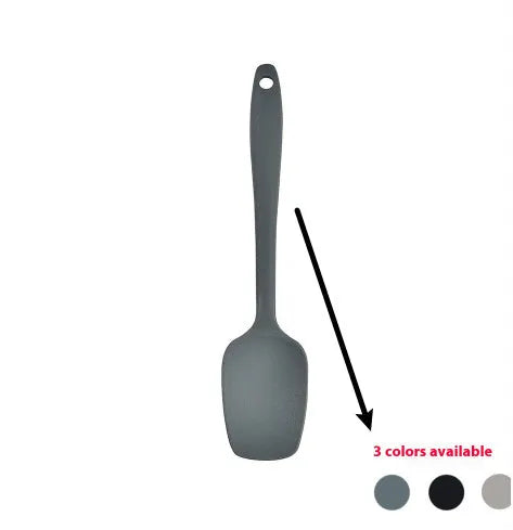 Silicone kitchen utensil set with twelve tools in a rotating white storage caddy on a counter.