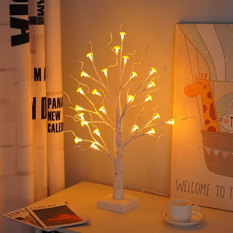 60cm tall white LED birch tree lamp with 24 small plastic mushroom-shaped warm white lights.