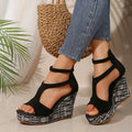 Women's cream white ankle-strap sandals with a buckle and thick rubber sole, shown from the side.