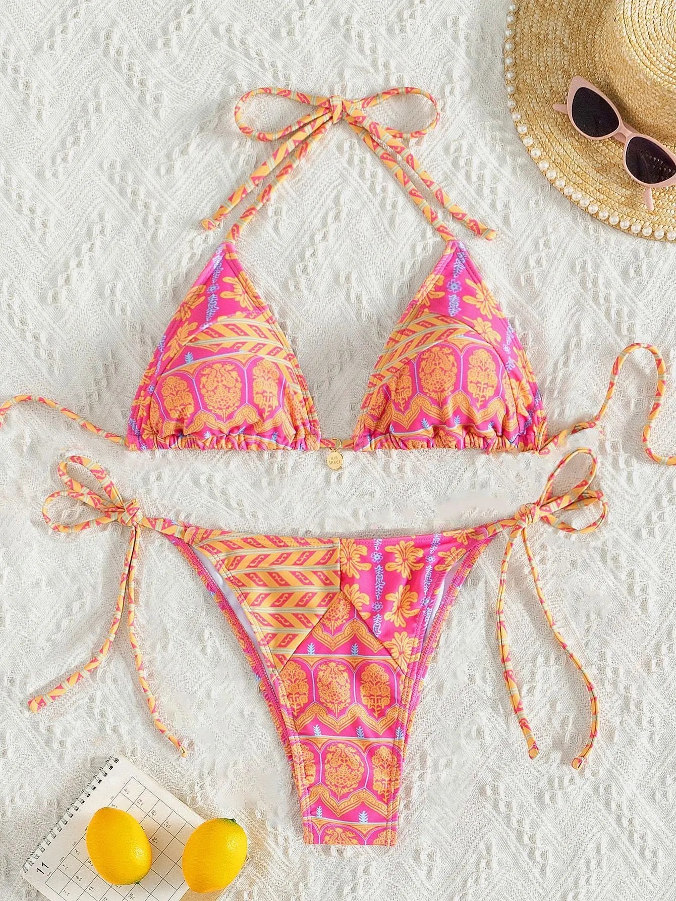 Women's bandage style split bikini swimsuit with stitching and printing details in multiple colour options