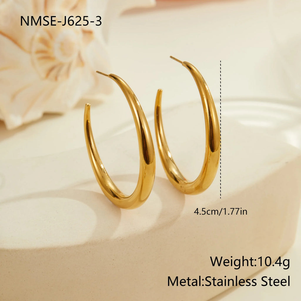 Geometric titanium steel hoop earrings for women in gold and steel finishes with round design elements