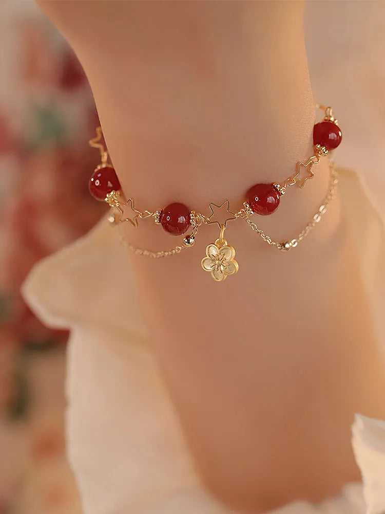 Women's red agate bracelet with double layer design and floral charms