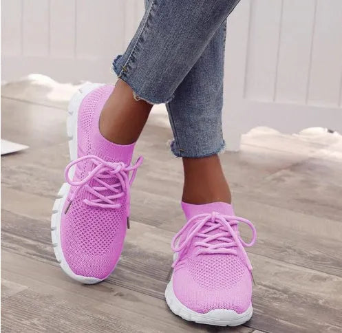 Women's breathable high-top lace-up platform sneaker in various colours on a casual background.