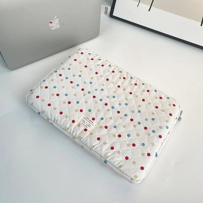 Women's polka dot laptop bag in polyester with breathable construction showing size options