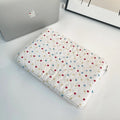 Women's polka dot laptop bag in polyester with breathable construction showing size options