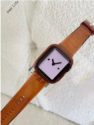 Brown transparent silicone replacement strap for Apple Watch, showing connector for compatible models.