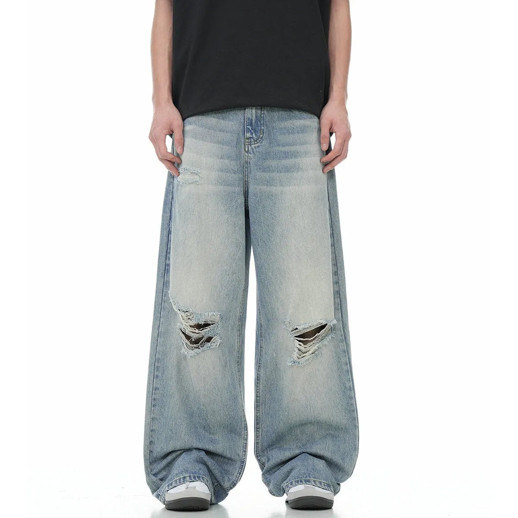 Blue retro straight-leg jeans with ripped details on a mannequin.