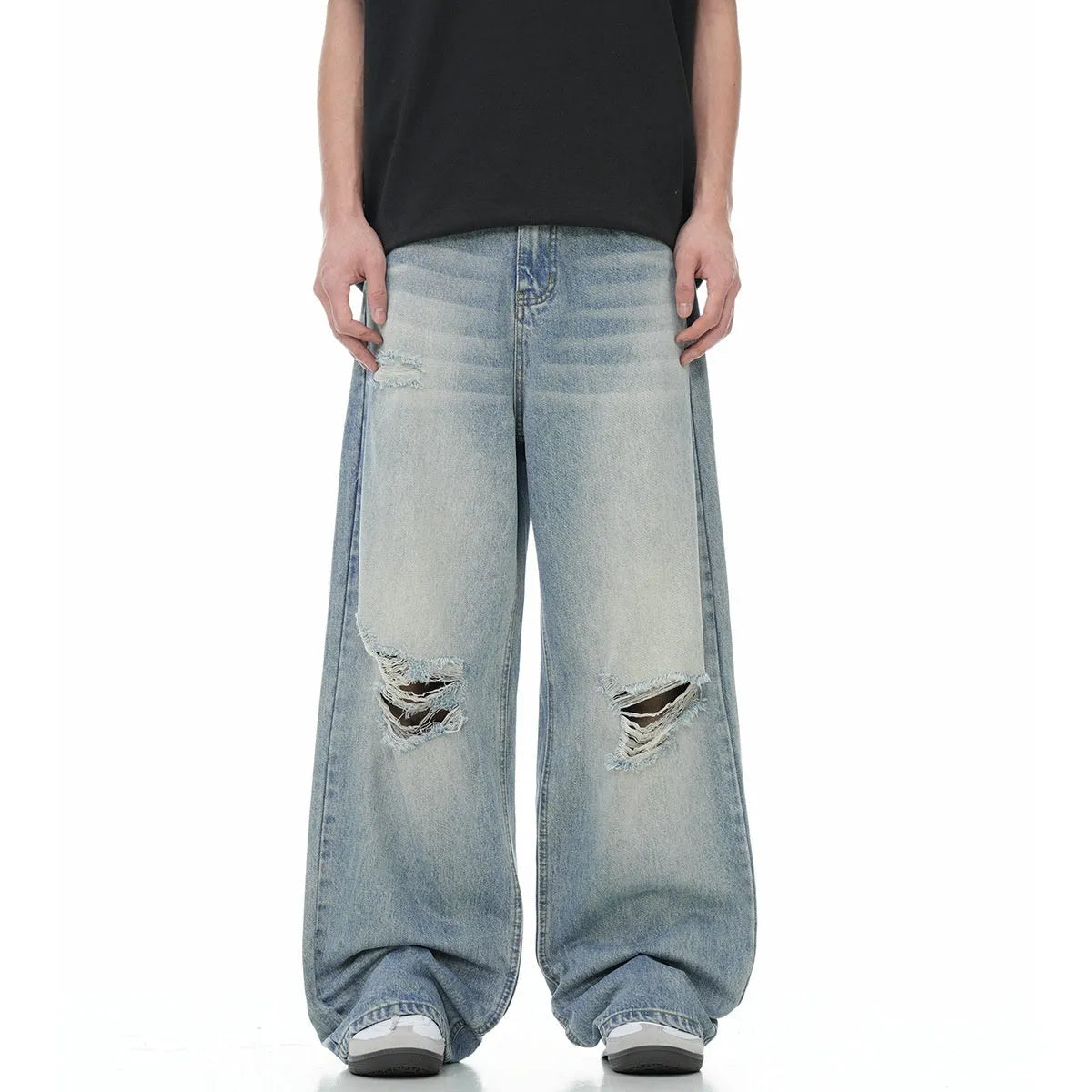 Blue retro straight-leg jeans with ripped details on a mannequin.
