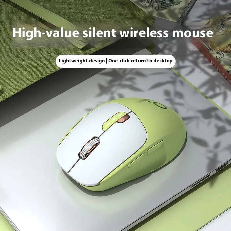 Compact mute wireless Bluetooth mouse in matcha green colour on a wooden desk