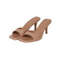 Square toe stiletto heel sandals in nude colour with rubber sole on white background