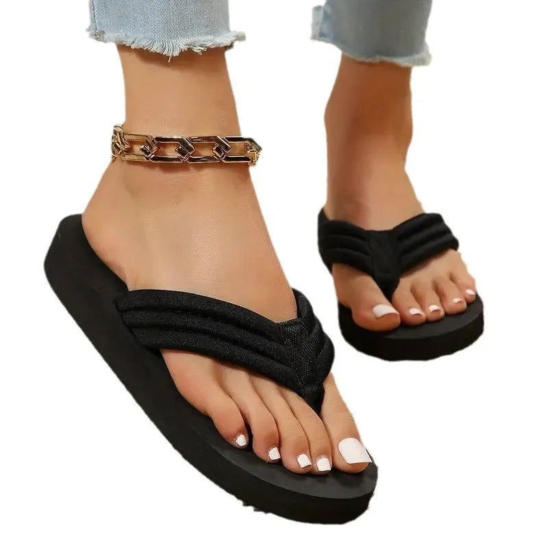 Black women's flat slippers with cotton upper and ribbon detail, sizes 36-44.