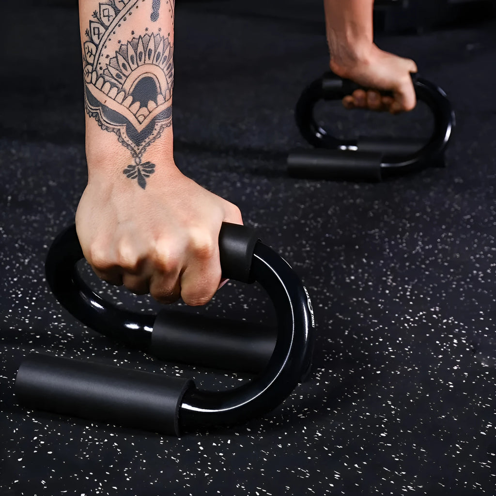 Black S shape push-up bracket rack measuring 20x12x13cm on a flat surface for home exercise