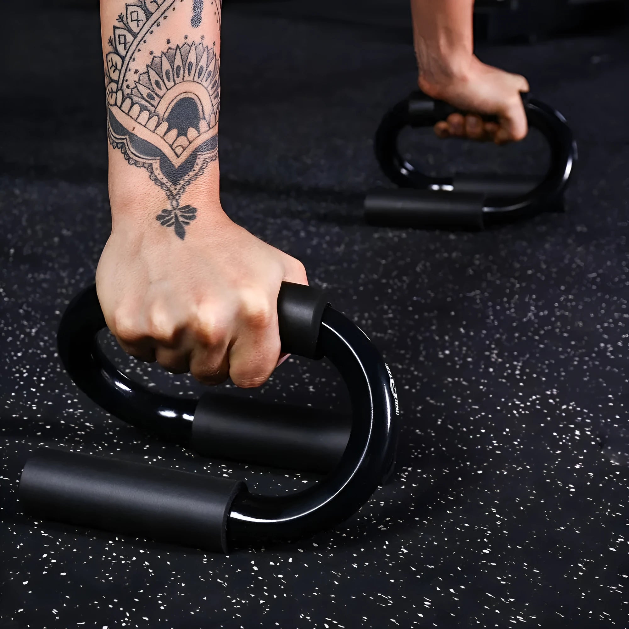 Black S shape push-up bracket rack measuring 20x12x13cm on a flat surface for home exercise